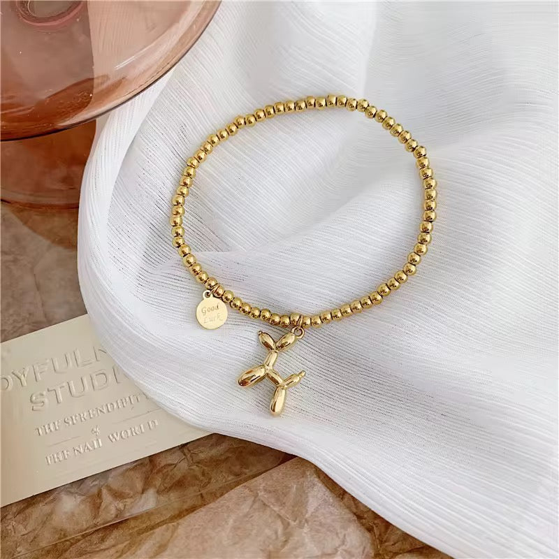 Gold Bead Bracelet with Balloon Poodle Dog and Good Luck Charm