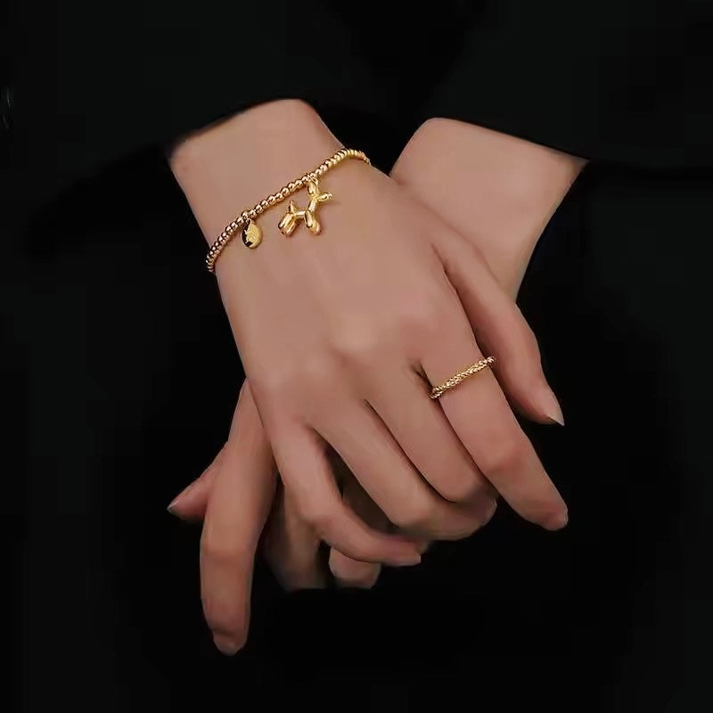 Gold Bead Bracelet with Balloon Poodle Dog and Good Luck Charm