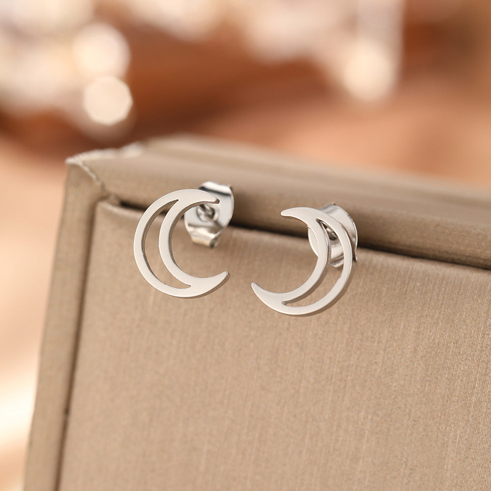 Pair of silver-tone stainless steel hollow moon stud earrings with butterfly backs