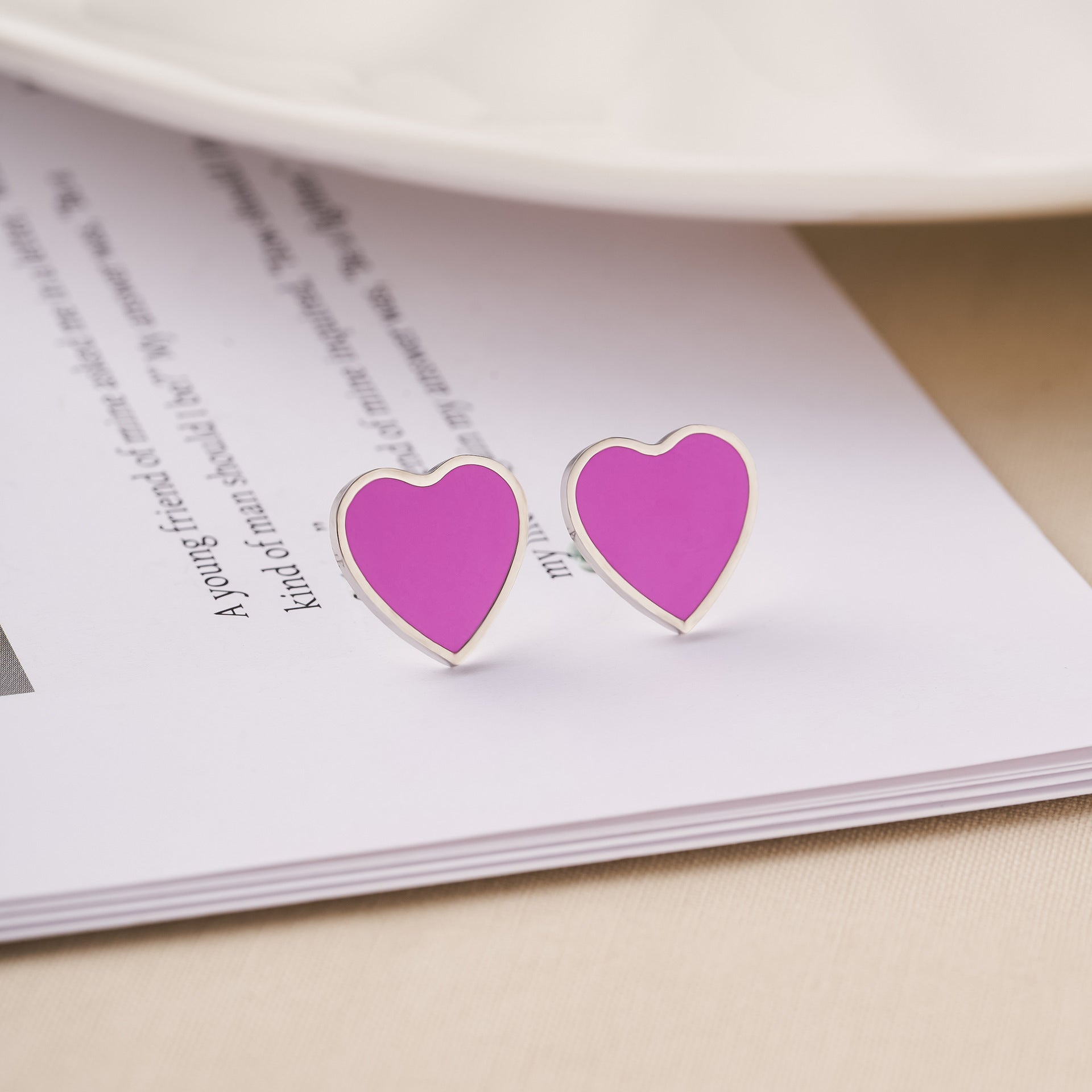 Magenta heart stud earrings with bright pink enamel finish