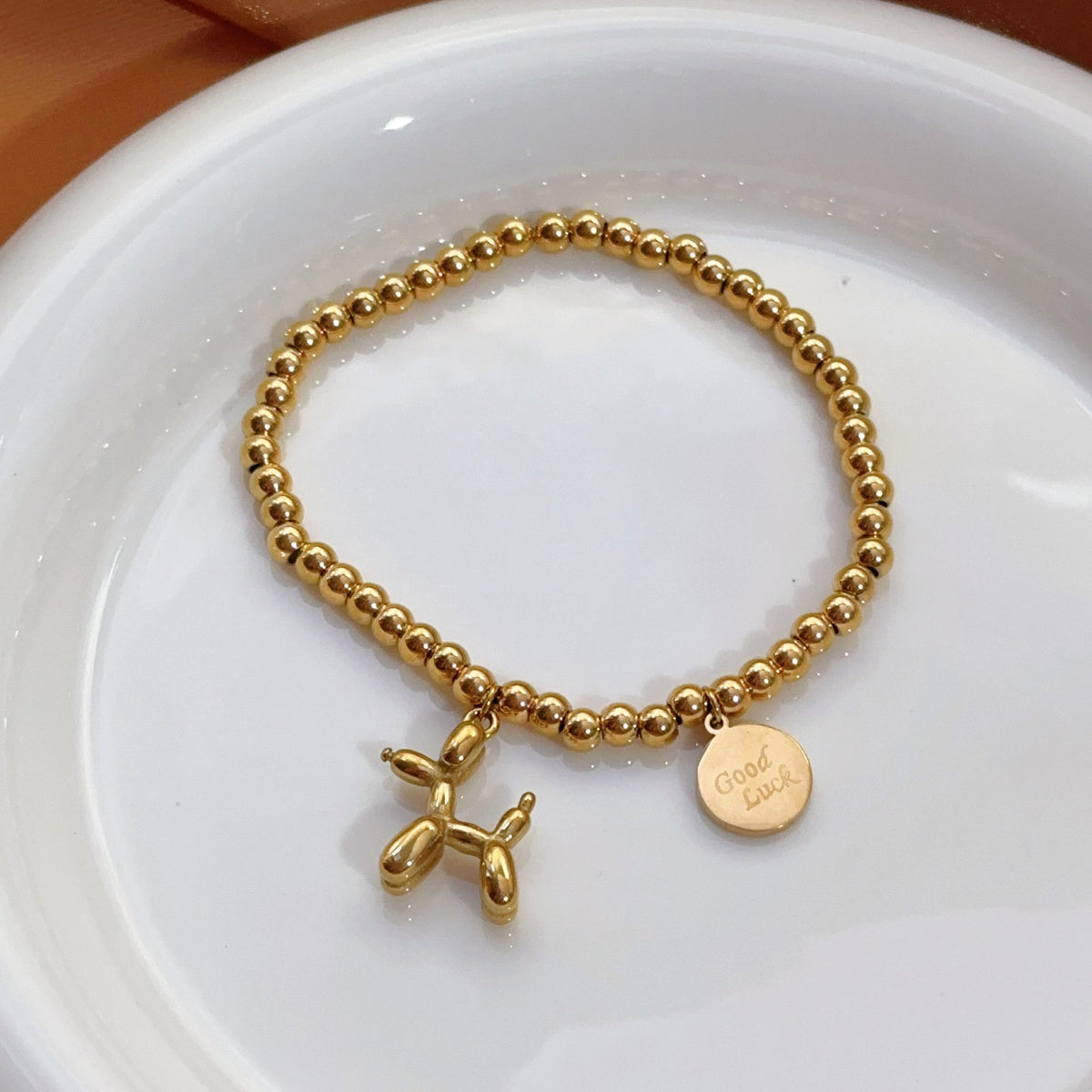 Gold Bead Bracelet with Balloon Poodle Dog and Good Luck Charm