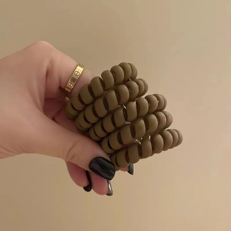Matte brown spiral telephone-cord hair tie