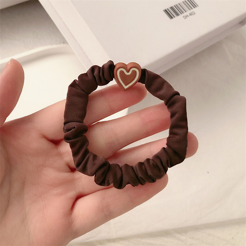 Dark coffee scrunchie hair tie with a brown heart charm