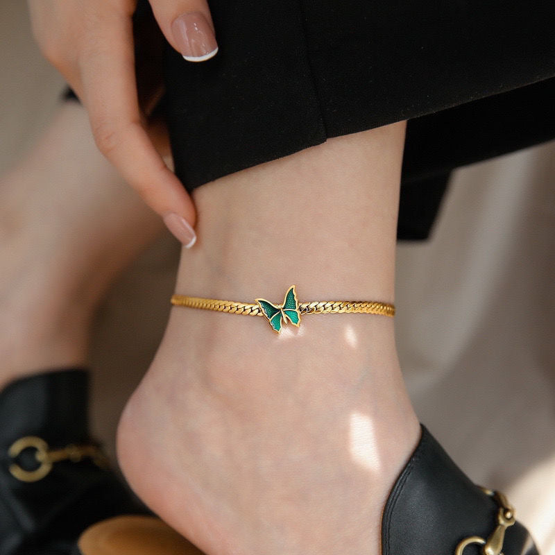 Gold chain anklet with a green enamel butterfly charm